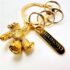 0597-Móc chìa khóa-MIKIMOTO gold bear keychain-Khá mới/chưa sử dụng1